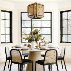 dining room table of 6 under a geomentric chandelier